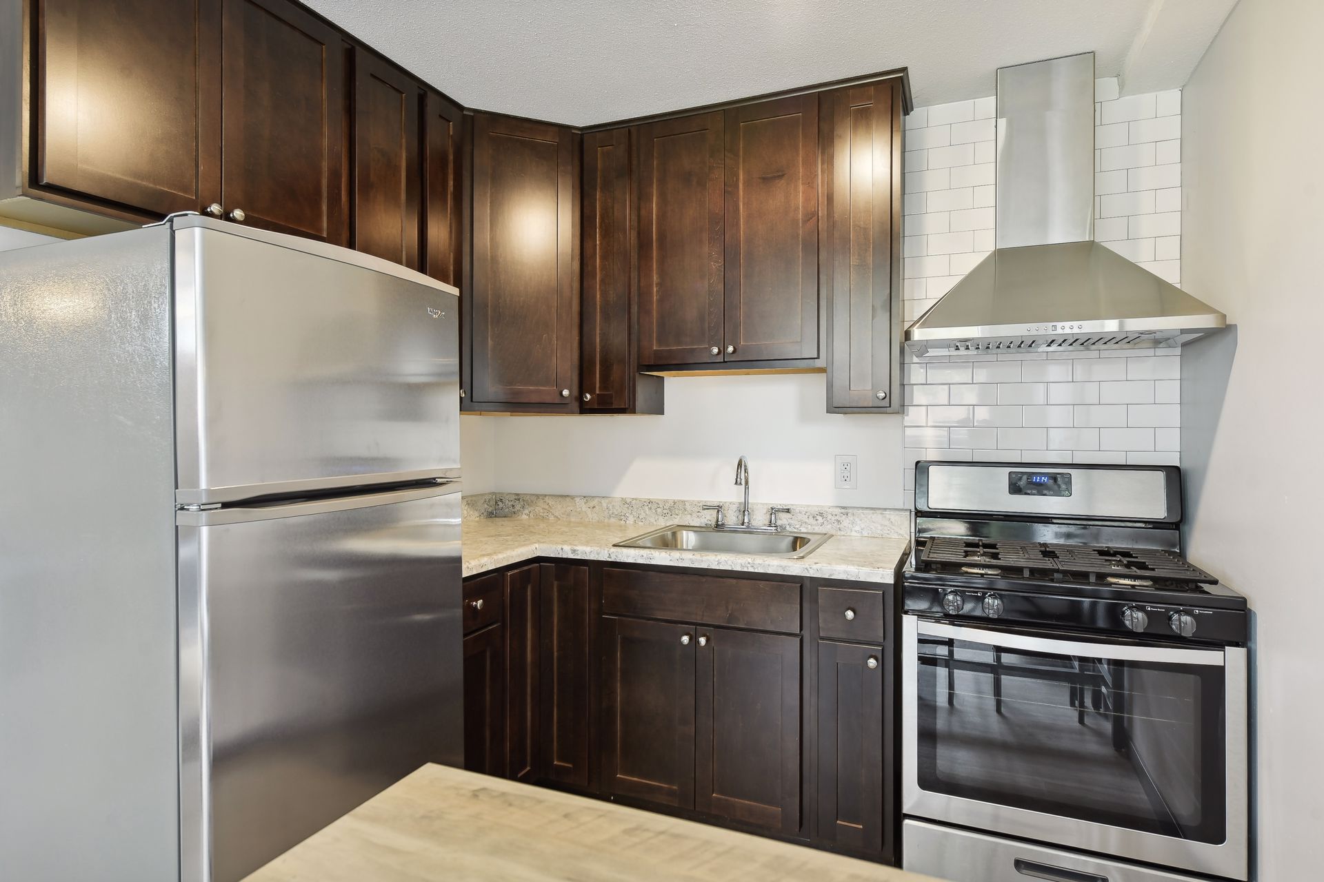 Studio apartment kitchen with full-szied appliances